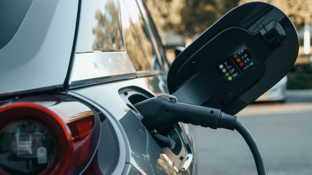 Gray car being charged by a home installed EV charge station